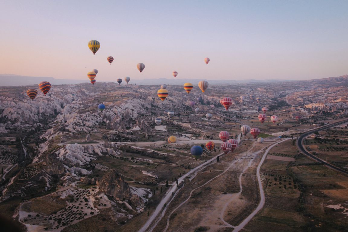 Fairy chimney rock formations in Cappadocia against a blue sky